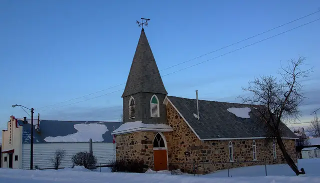 Stone Anglican church in winter